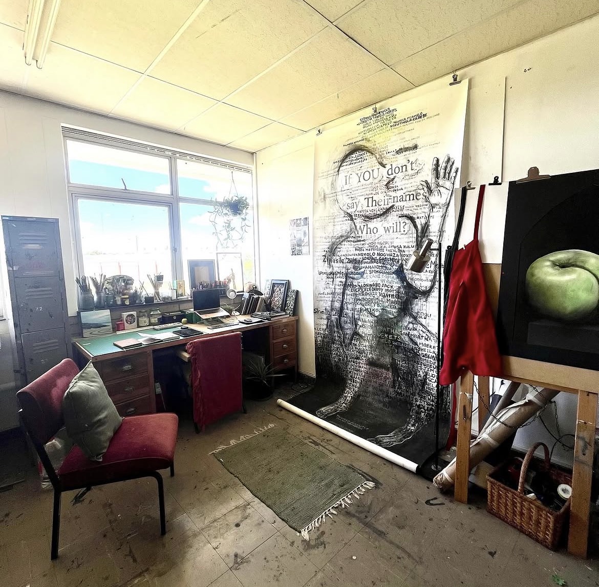 The studio, with If You Don't Say Their Names hanging on the wall