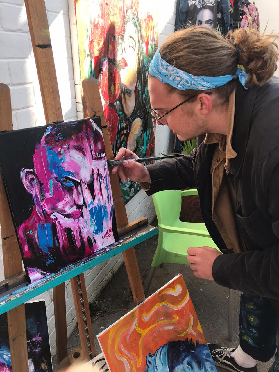 Working on a portrait in acrylic